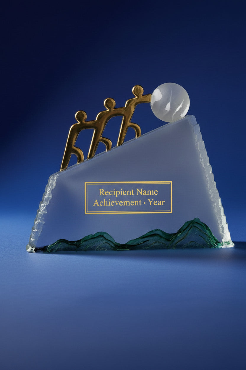 Decorative sculpture of three gold figures standing on a white platform with a blue background