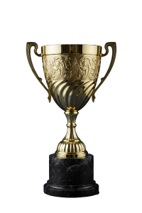 Gold trophy with intricate designs on a black base against a dark blue background